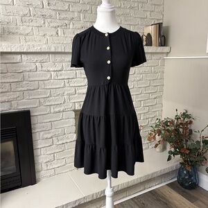 Monteau Los Angelea Black Mini Dress. Pearl coloured Buttons with Gold Bows